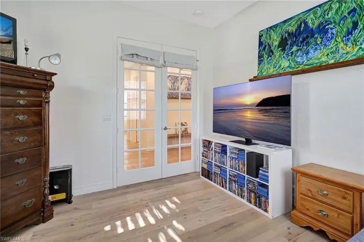 Living area featuring wood finished floors and french doors