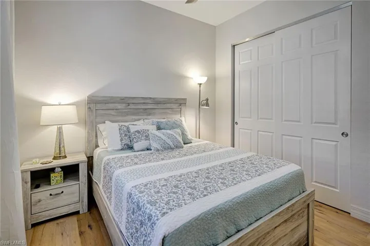Bedroom with a closet and light wood finished floors