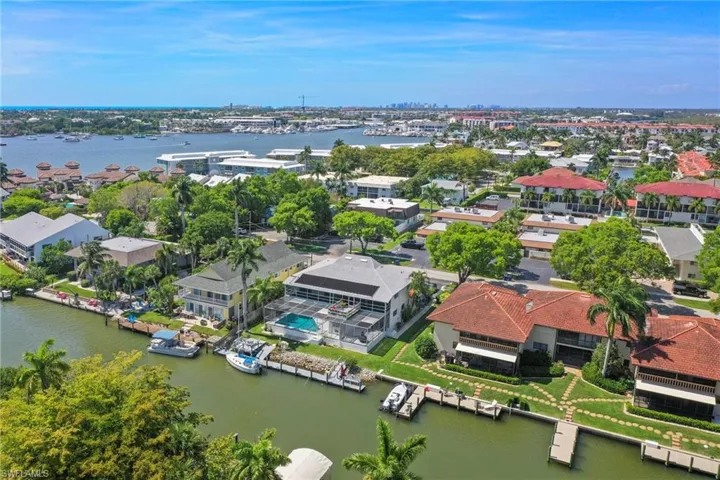 Waterfront property featuring extensive dockage, an in-ground swimming pool, and solar panels