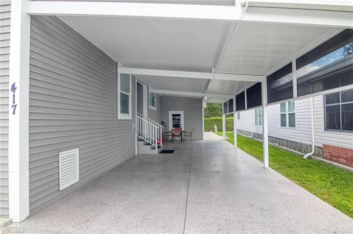 View of patio with a carport and entry steps