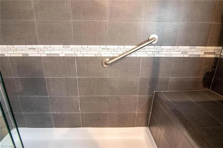 Full bath with a tile shower