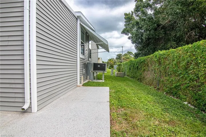 View of yard with a a/c and a patio
