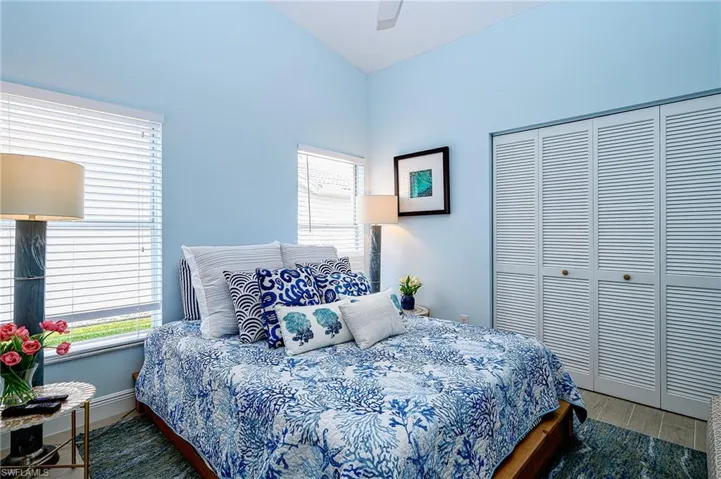 Guest room with closet nd tv.
