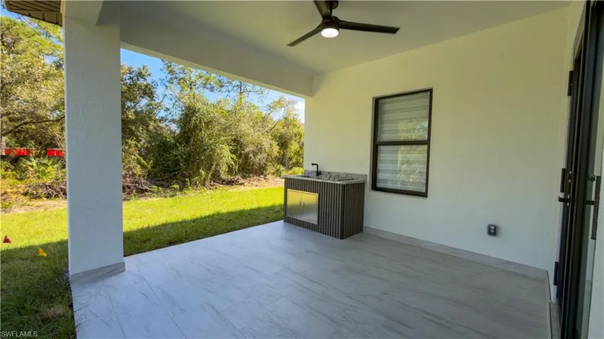 View of patio with ceiling fan