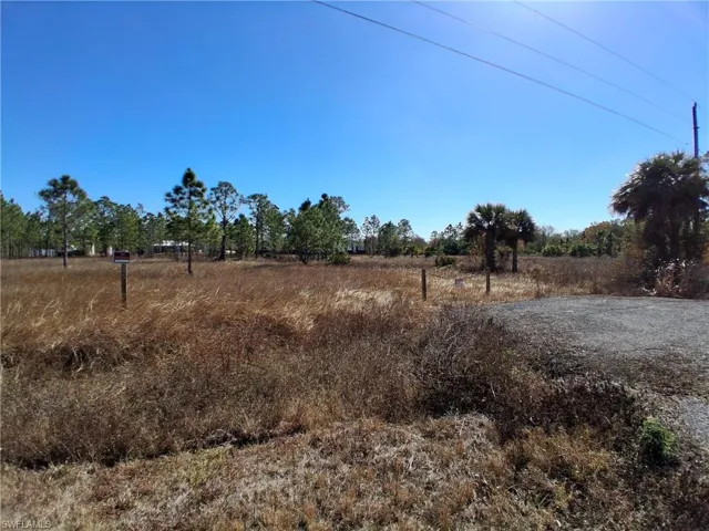 View of yard with a rural view