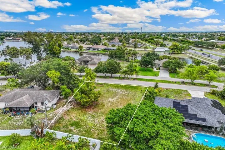 Expansive undeveloped land parcel featuring a clear boundary outline, and direct road frontage