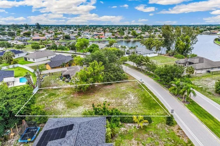 Residential lot, situated along a paved road and established residences.