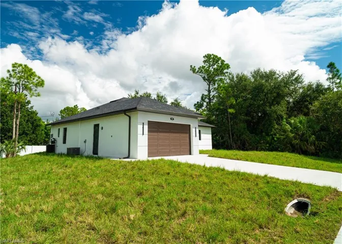 Garage with concrete driveway