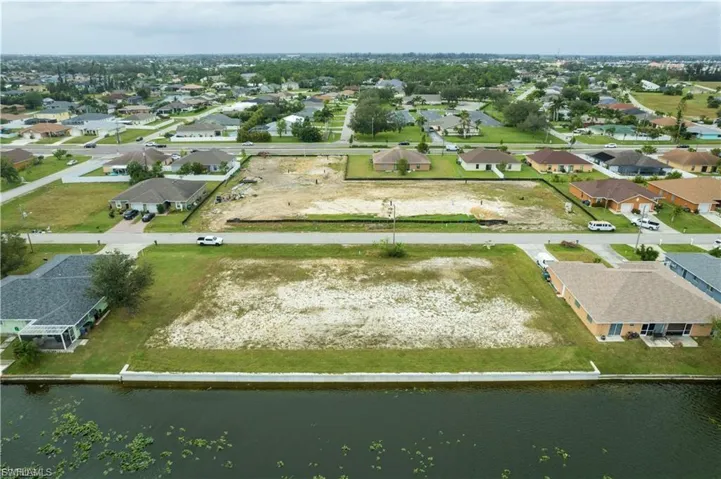 View of property location with nearby suburban area