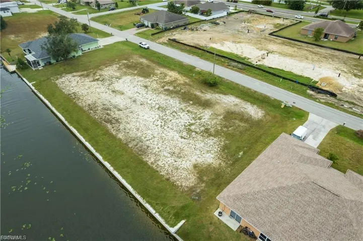 Aerial view of residential area with a large body of water
