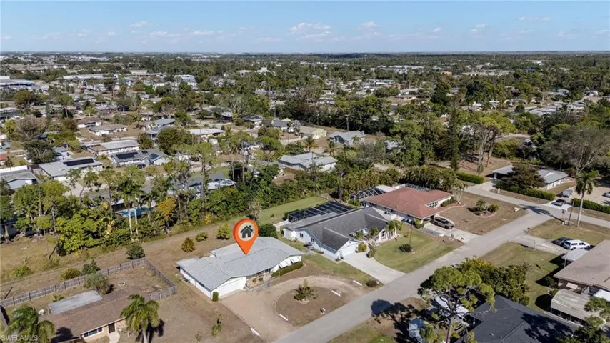 Aerial overview of property's location featuring nearby suburban area