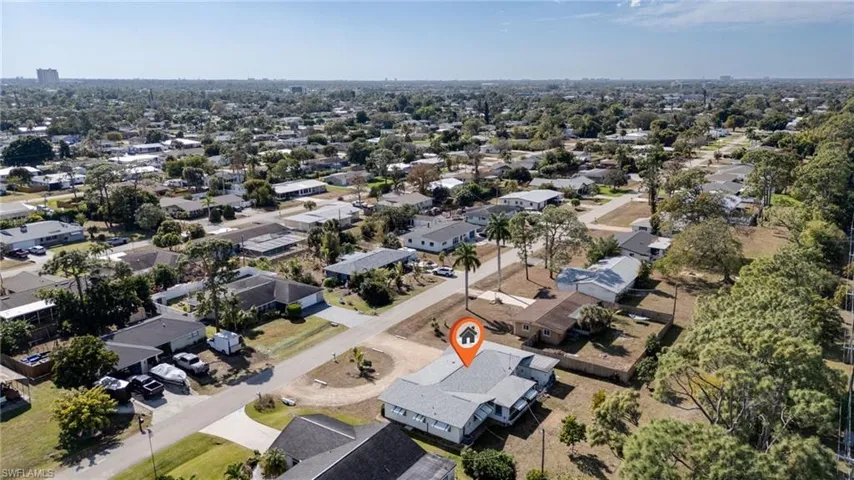View of property location with nearby suburban area