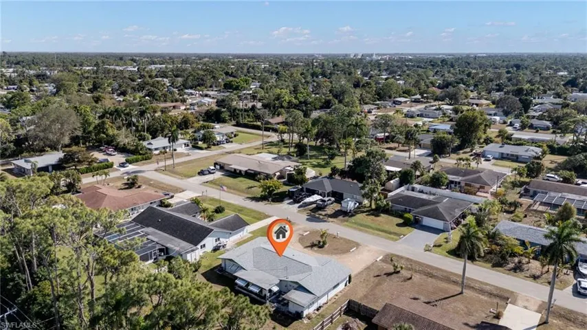 Aerial overview of property's location featuring nearby suburban area
