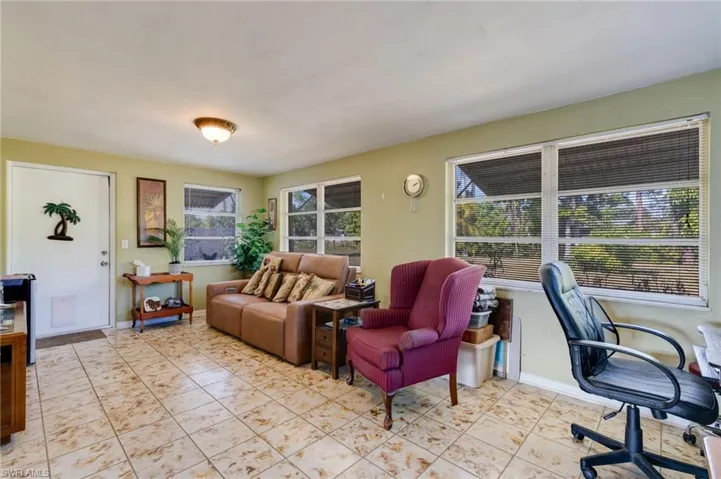 Office space featuring baseboards and light tile patterned floors