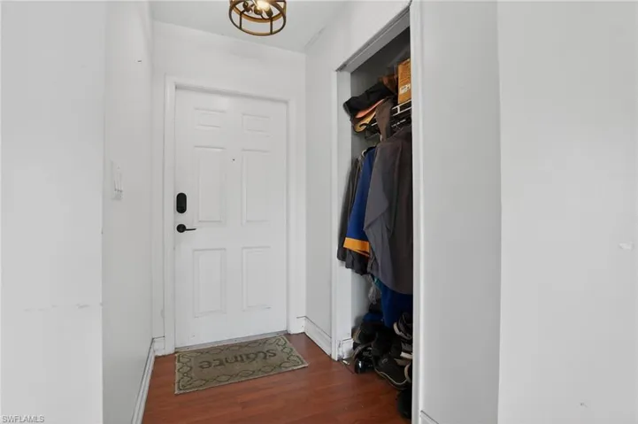Doorway to outside featuring wood finished floors