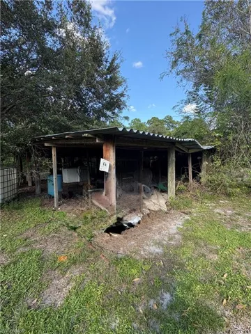 Outdoor shelter featuring timber post construction and a corrugated metal roof
