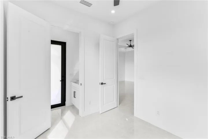 Unfurnished bedroom featuring ceiling fan, recessed lighting, and light tile patterned flooring