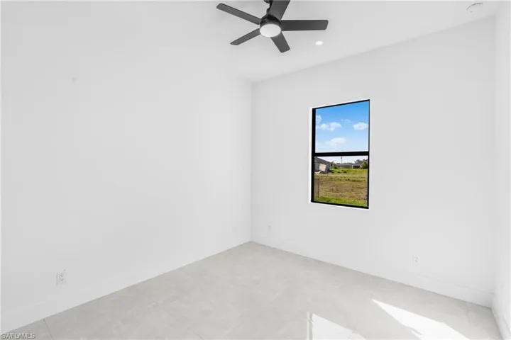 Unfurnished room featuring ceiling fan and recessed lighting