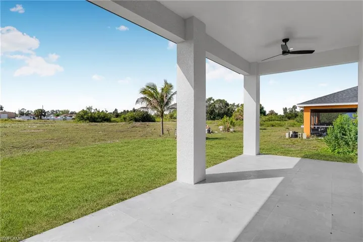 View of patio featuring a ceiling fan