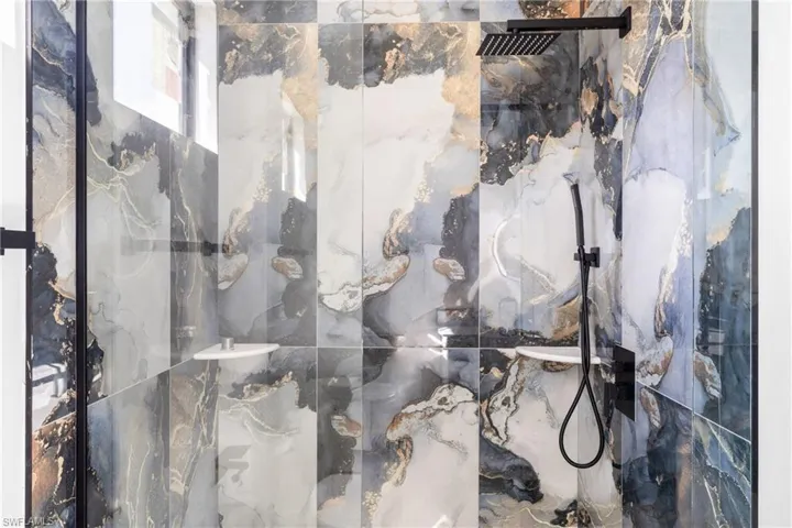 Bathroom view of a marble finish shower