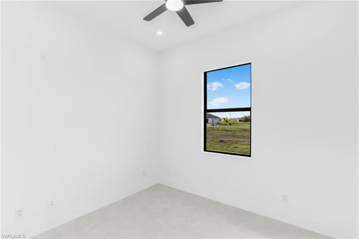 Spare room featuring a ceiling fan and recessed lighting