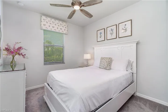 Bedroom with carpet flooring and a ceiling fan