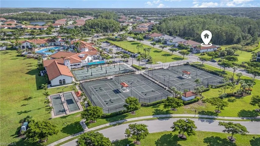 Aerial view of residential area featuring a pool