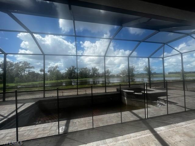 pool and spa under construction with water and preserve view