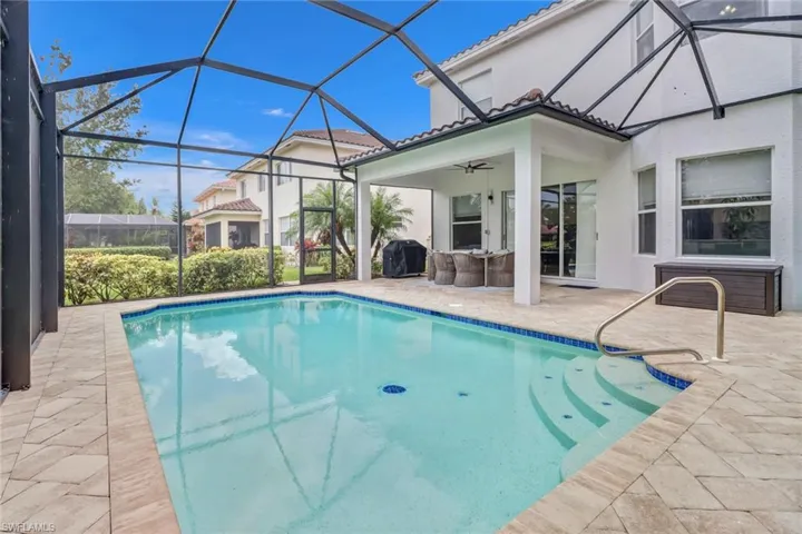 View of pool featuring a lanai, a grill, a patio, and ceiling fan