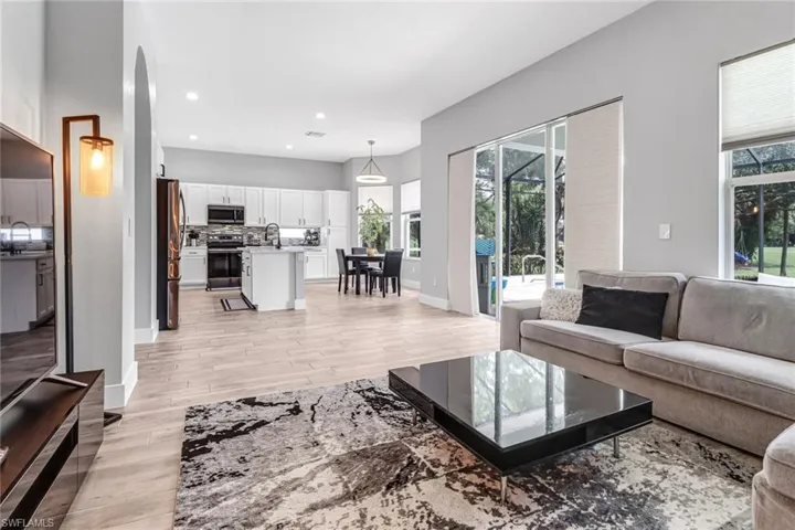 Living room with light hardwood / wood-style floors