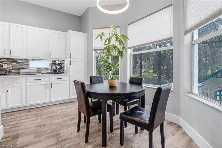 Dining room featuring light hardwood / wood-style flooring and a wealth of natural light