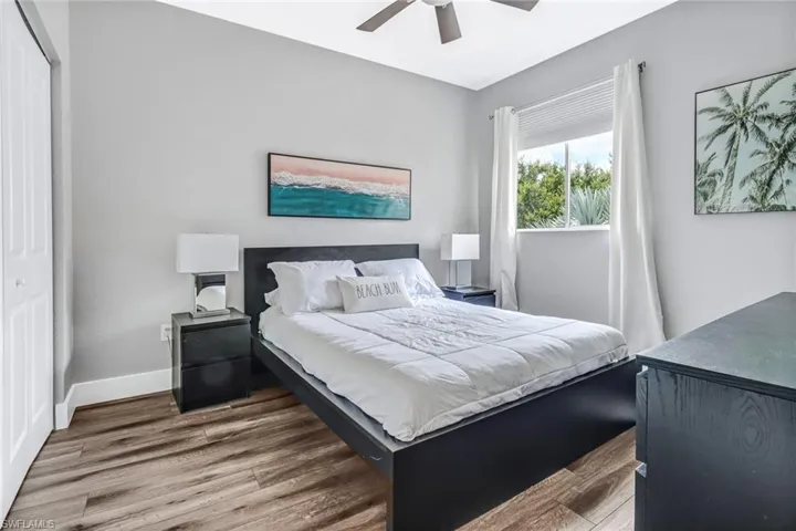 Bedroom featuring hardwood / wood-style flooring, a closet, and ceiling fan