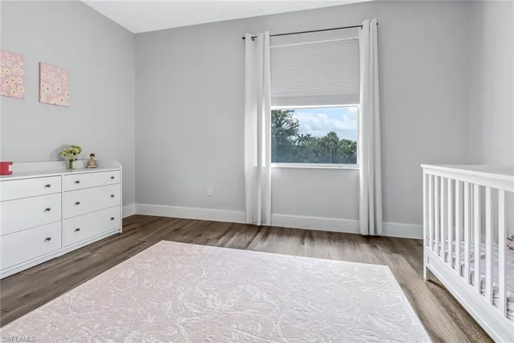 Unfurnished bedroom featuring hardwood / wood-style floors