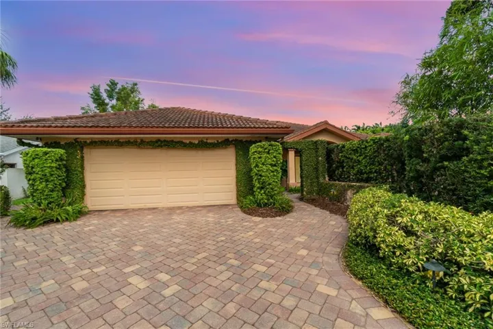 View of front of home featuring a garage