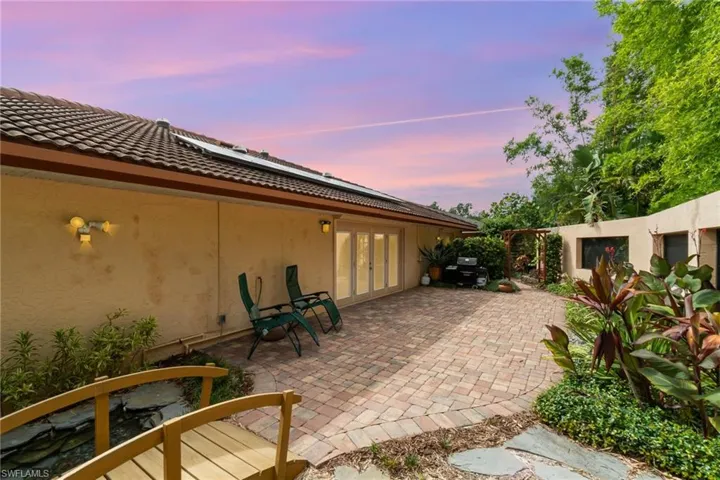 Patio terrace at dusk with french doors