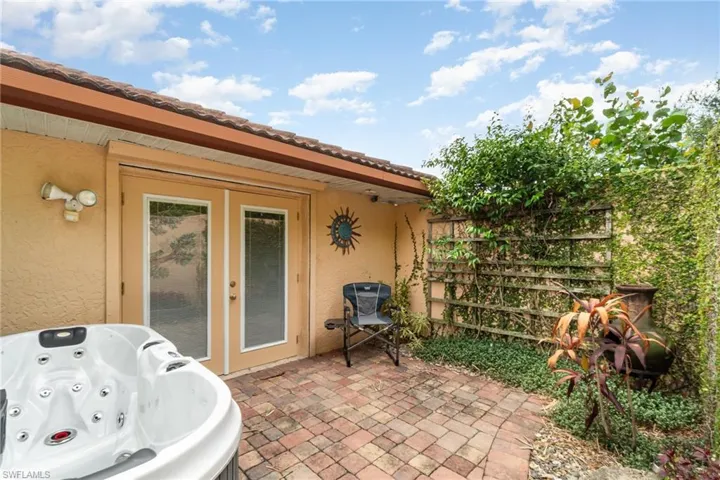 View of patio / terrace with a hot tub