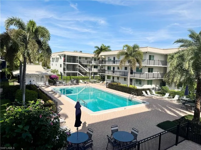 Community pool featuring a patio area