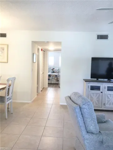 Living & Dining Area with guest room in background