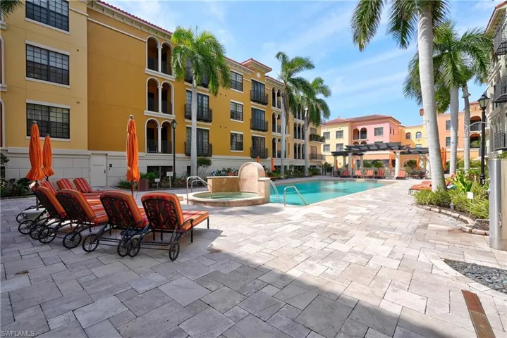 View of swimming pool with a patio and a pergola