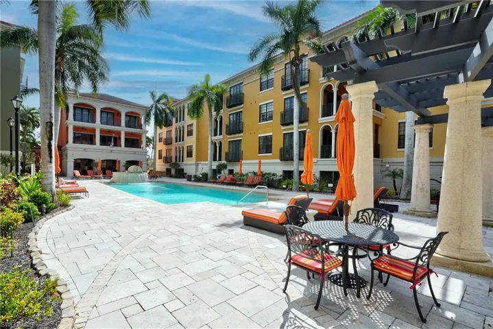 View of pool featuring a pergola, a patio area, and pool water feature