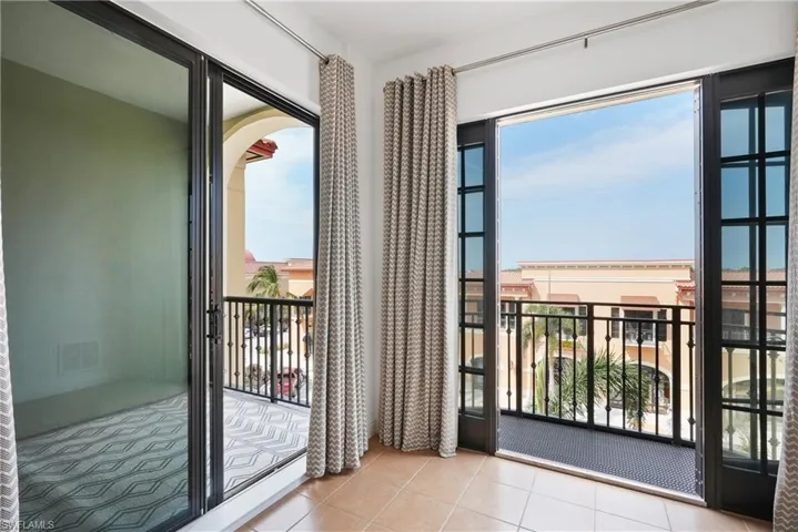 Doorway to outside with light tile patterned flooring