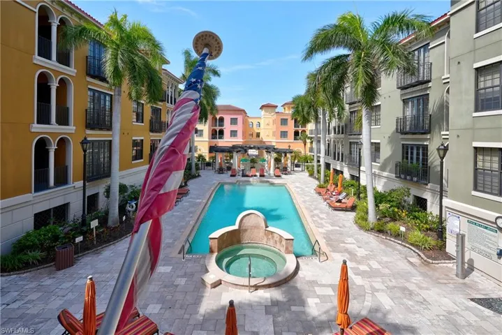 View of pool featuring a hot tub