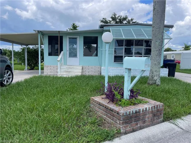 View of front of home with a carport