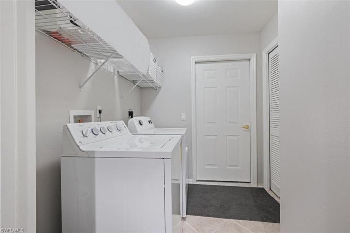 Laundry room with entrance to the 1 car garage