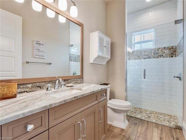 Bath #4 serves both bedrooms #4 and #5 as well as being the powder room for the great room living area.