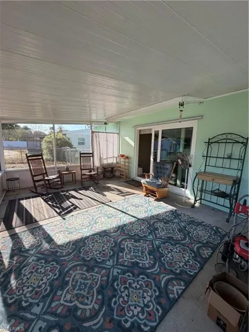 View of patio / terrace featuring a sunroom