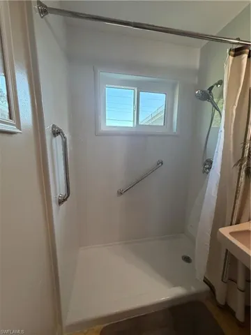 Bathroom featuring a shower stall