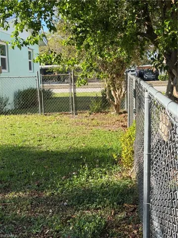 View of yard with a gate