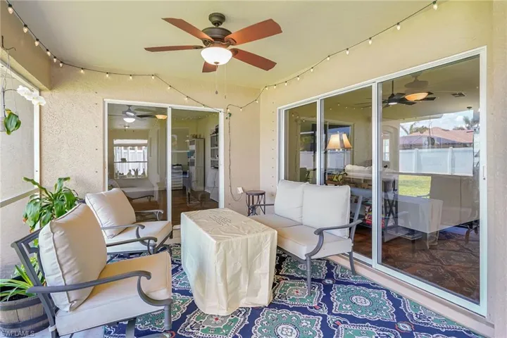 Screened-In Lanai. Sliders lead into Den (left), and Main living area (right)
