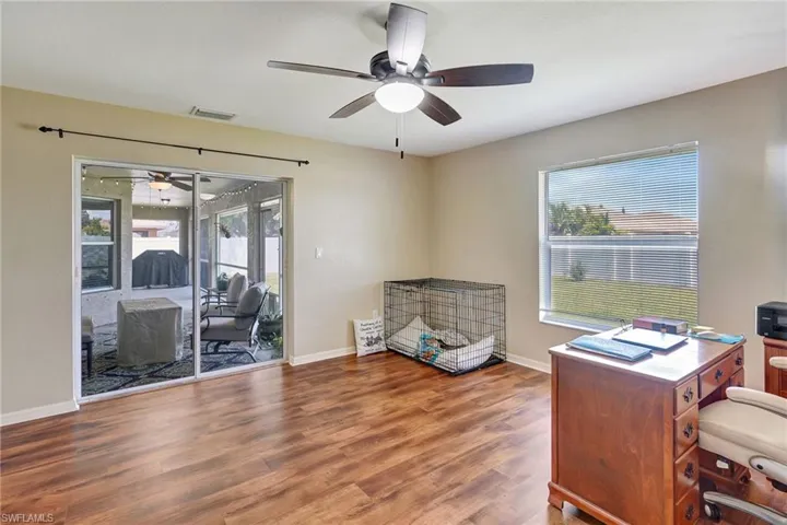 Huge Den (could be used as 2nd Living Room, an Office, a Workout Room, or a 4th Bedroom) with Lanai access and views of backyard